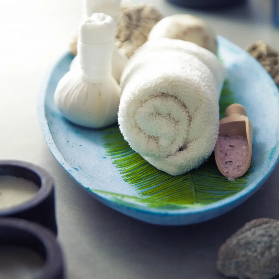 spa items on a blue tray with candles