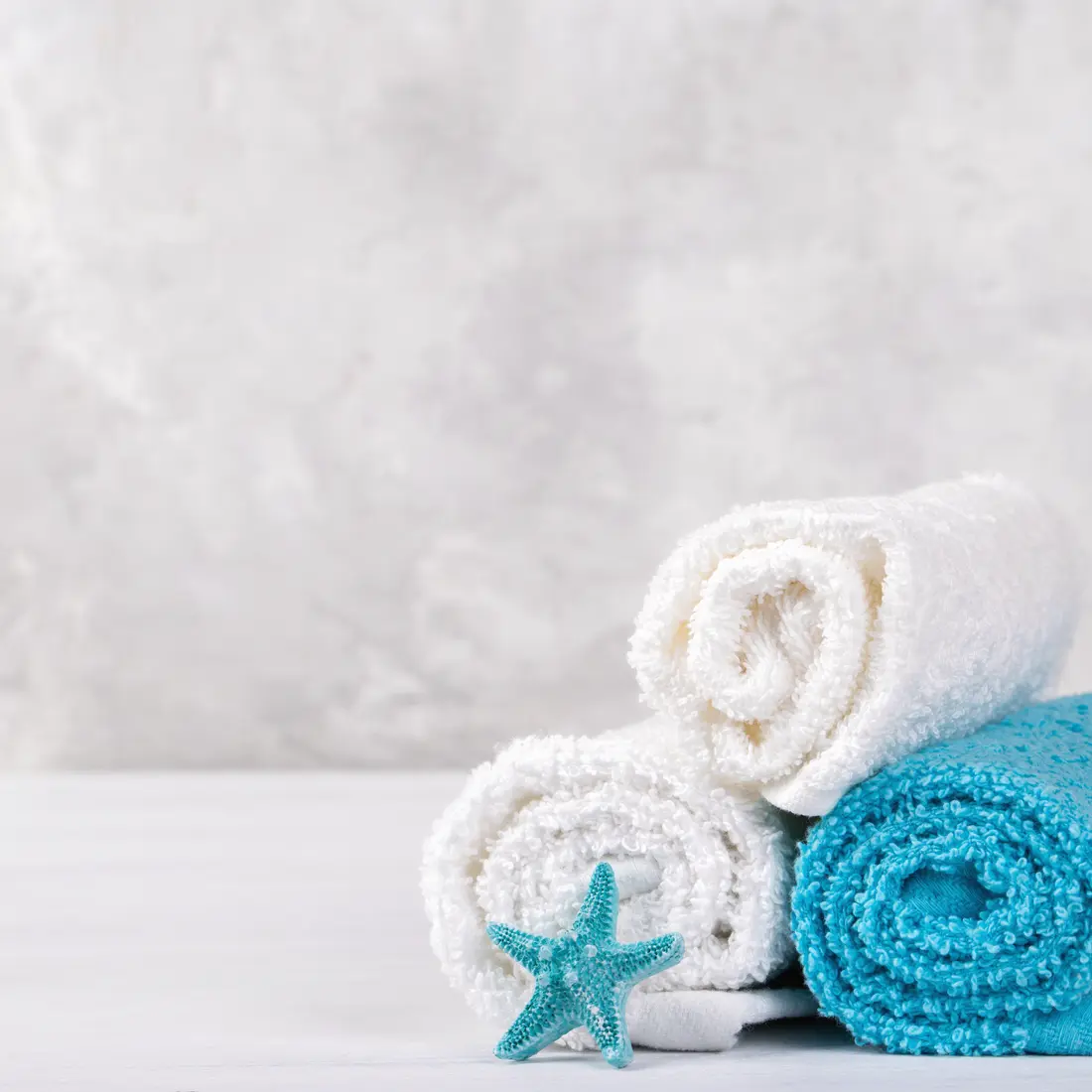 rolled spa towels with a starfish decoration